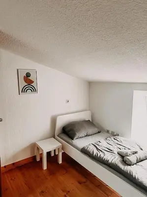 Ein Bett oder Betten in einem Zimmer der Unterkunft Wohnen im ruhigen Mülheim an der Ruhr. UDG