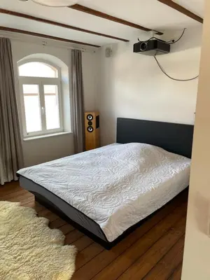 Ein Bett oder Betten in einem Zimmer der Unterkunft Denkmalgeschütztes Schmuckstück