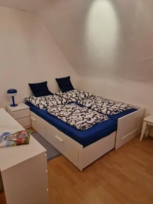 Ein Bett oder Betten in einem Zimmer der Unterkunft Ruhrpottbude - Private Ferienwohnung im Herzen des Ruhrgebiets