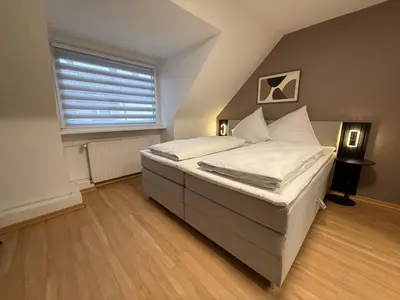 Ein Bett oder Betten in einem Zimmer der Unterkunft Shin Central