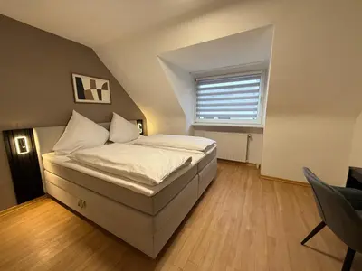 Ein Bett oder Betten in einem Zimmer der Unterkunft Shin Central