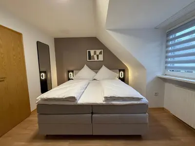 Ein Bett oder Betten in einem Zimmer der Unterkunft Shin Central