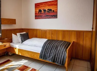 Ein Bett oder Betten in einem Zimmer der Unterkunft Hotel Zur Aue