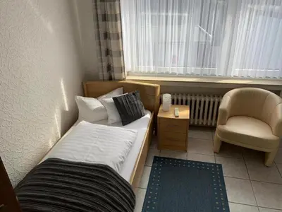 Ein Bett oder Betten in einem Zimmer der Unterkunft Hotel Zur Aue