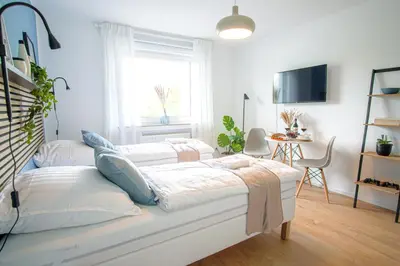 Ein Bett oder Betten in einem Zimmer der Unterkunft HOMEFY - Studio Heaven