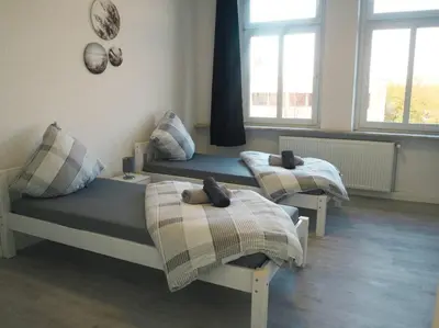 Ein Bett oder Betten in einem Zimmer der Unterkunft City Wohnung Zentral 89-10
