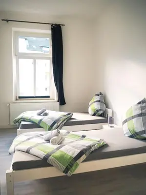 Ein Bett oder Betten in einem Zimmer der Unterkunft City Wohnung Zentral 89-10
