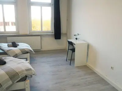 Ein Bett oder Betten in einem Zimmer der Unterkunft City Wohnung Zentral 89-10
