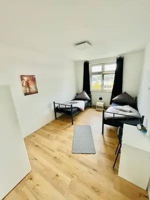 Ein Bett oder Betten in einem Zimmer der Unterkunft City Wohnung Zentral 85-5