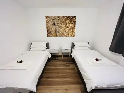 Ein Bett oder Betten in einem Zimmer der Unterkunft Messe HV-1