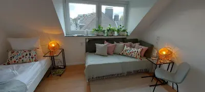 Ein Bett oder Betten in einem Zimmer der Unterkunft RüStudio, Nähe RÜ & Messe, Museum Folkwang, NETFLIX