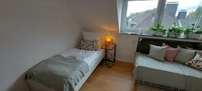 Ein Bett oder Betten in einem Zimmer der Unterkunft RüStudio, Nähe RÜ & Messe, Museum Folkwang, NETFLIX