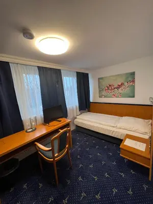 Ein Bett oder Betten in einem Zimmer der Unterkunft Hotel 9-enhof