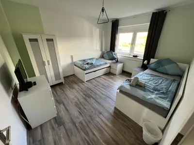Ein Bett oder Betten in einem Zimmer der Unterkunft Pluto
