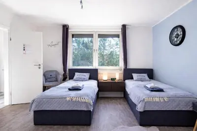 Ein Bett oder Betten in einem Zimmer der Unterkunft VAZ Apartments Corporate Living ca 15 Min Messe u HBf