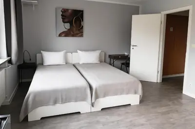 Ein Bett oder Betten in einem Zimmer der Unterkunft VAZ Apartments Corporate Living ca 15 Min Messe u HBf