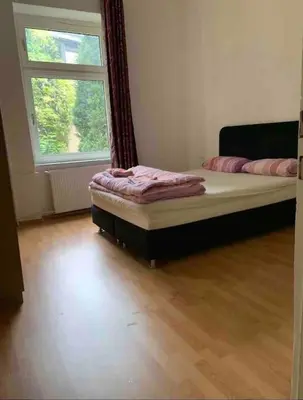 Ein Bett oder Betten in einem Zimmer der Unterkunft FeWo Born