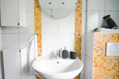 Ein Badezimmer in der Unterkunft HOMEFY - Holiday Apartment