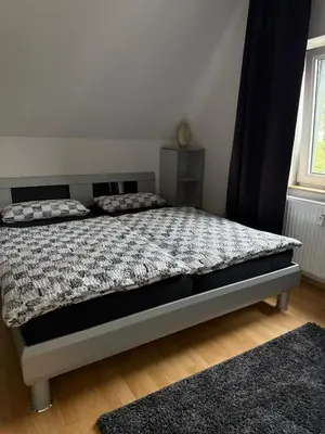 Ein Bett oder Betten in einem Zimmer der Unterkunft Hammer Wohnung