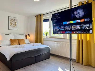 Ein Bett oder Betten in einem Zimmer der Unterkunft Design Apartment, Küche, Smart-TV, WLAN