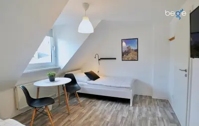 Ein Bett oder Betten in einem Zimmer der Unterkunft BEGE APARTMENTS: BUSINESS QUARTERS