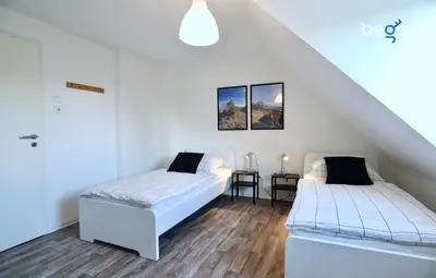Ein Bett oder Betten in einem Zimmer der Unterkunft BEGE APARTMENTS: BUSINESS QUARTERS