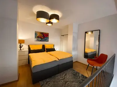 Ein Bett oder Betten in einem Zimmer der Unterkunft Loftcharakter auf 2 Etagen - Zentral in Essen!