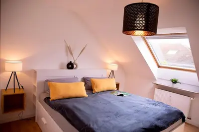 Ein Bett oder Betten in einem Zimmer der Unterkunft Stilvolles Apartment - Messe Rü Innenstadt