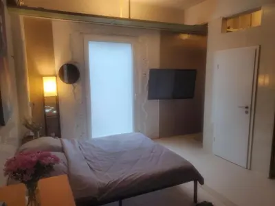 Ein Bett oder Betten in einem Zimmer der Unterkunft SPA industrial Loft im ehemaligen Umspannwerk Schaltzentrale
