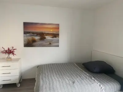 Ein Bett oder Betten in einem Zimmer der Unterkunft Gemütliches Zuhause in 1A Lage