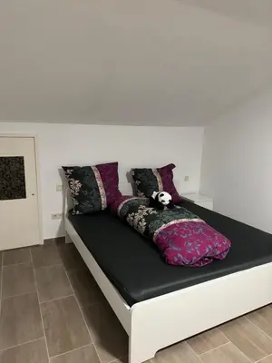 Ein Bett oder Betten in einem Zimmer der Unterkunft Wohnung mit Küche, Fernseher, WLAN und Parkplatz - Brian