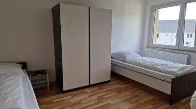 Ein Bett oder Betten in einem Zimmer der Unterkunft Meribu E1 Wohnung für Monteure und Arbeiter