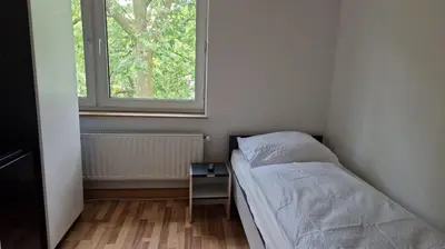 Ein Bett oder Betten in einem Zimmer der Unterkunft Meribu E1 Wohnung für Monteure und Arbeiter