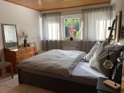 Ein Bett oder Betten in einem Zimmer der Unterkunft Ferienwohnung100qm mit Garten