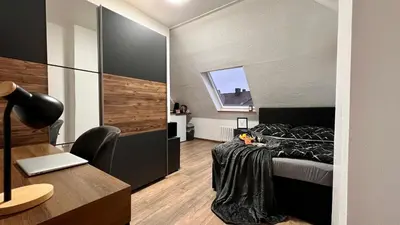 Ein Bett oder Betten in einem Zimmer der Unterkunft PrimeTime Suite für 2 mit Küche