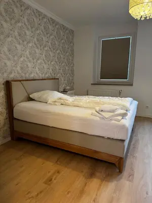 Ein Bett oder Betten in einem Zimmer der Unterkunft Paris: Messe-, Business-, Ferienwohnung