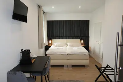 Ein Bett oder Betten in einem Zimmer der Unterkunft TOKA ROOMS - an der Regiobahn