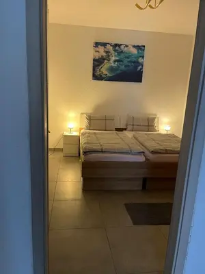 Ein Bett oder Betten in einem Zimmer der Unterkunft Ferienwohnung