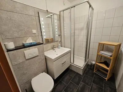 Ein Badezimmer in der Unterkunft FEWO FAUBEL Mülheim Forum City 60 m2 inclusive Garagenstellplatz