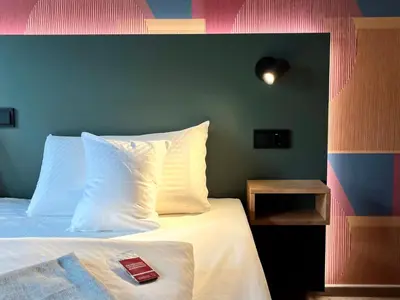 Ein Bett oder Betten in einem Zimmer der Unterkunft Kloster-Quartier