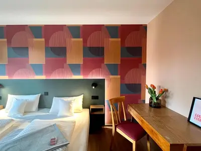 Ein Bett oder Betten in einem Zimmer der Unterkunft Kloster-Quartier