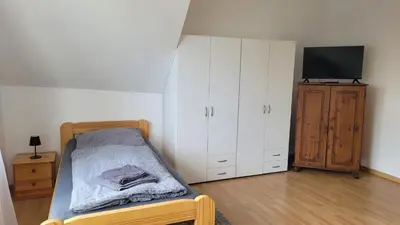 Ein Bett oder Betten in einem Zimmer der Unterkunft Ferienwohnung Gästehaus Bauer 2