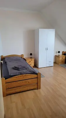 Ein Bett oder Betten in einem Zimmer der Unterkunft Ferienwohnung Gästehaus Bauer 2
