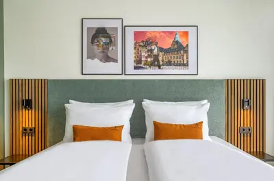 Ein Bett oder Betten in einem Zimmer der Unterkunft Aspire Palais Recklinghausen, Trademark Collection by Wyndham