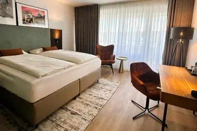 Ein Bett oder Betten in einem Zimmer der Unterkunft Aspire Palais Recklinghausen, Trademark Collection by Wyndham