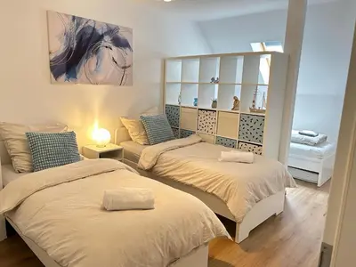 Ein Bett oder Betten in einem Zimmer der Unterkunft FeWo & Monteurwohnungen 2