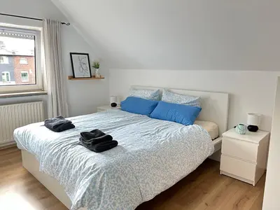 Ein Bett oder Betten in einem Zimmer der Unterkunft FeWo & Monteurwohnungen 2