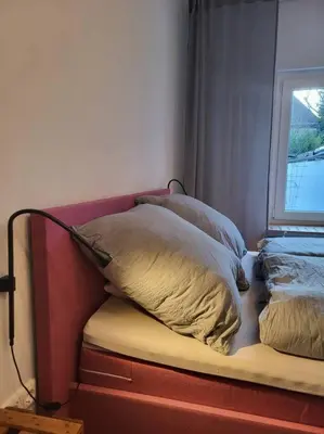 Ein Bett oder Betten in einem Zimmer der Unterkunft Ruhiges Apartment & Veranda mit guter Anbindung