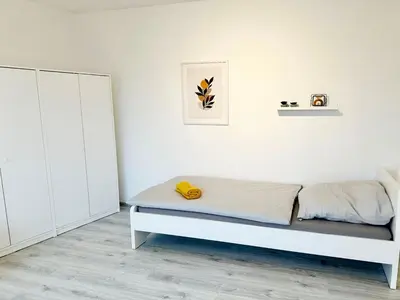 Ein Bett oder Betten in einem Zimmer der Unterkunft Cozy Apartment in Wuppertal