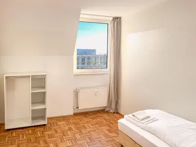 Ein Bett oder Betten in einem Zimmer der Unterkunft T&K Apartments - 2 - 5 Room Apartments - Heart of Solingen-Hofgarten